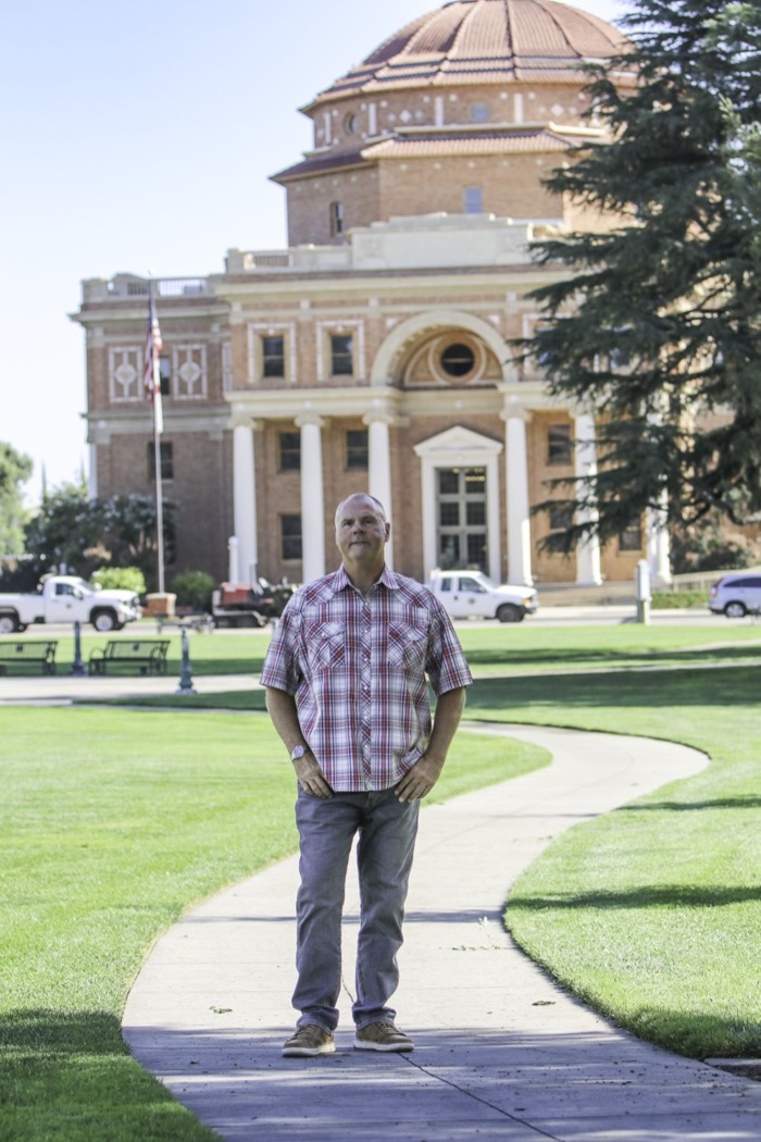 Mike Avila standing on the walkway in front of the Atascadero City Hall rotunda